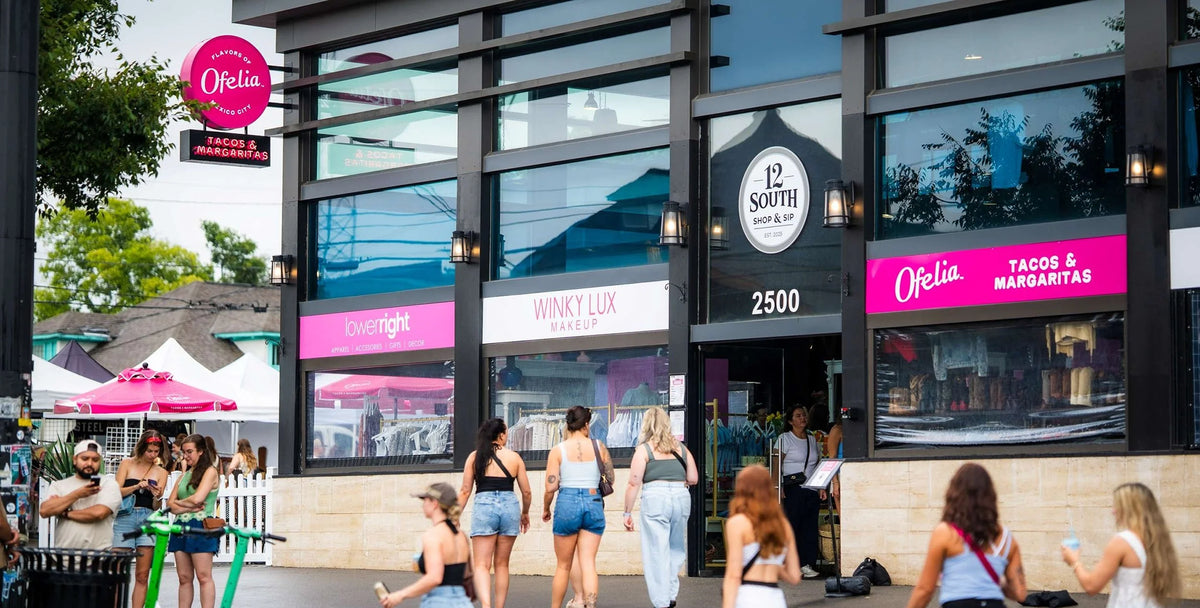 Shoppers outside a storefront on 12th Avenue South in Nashville