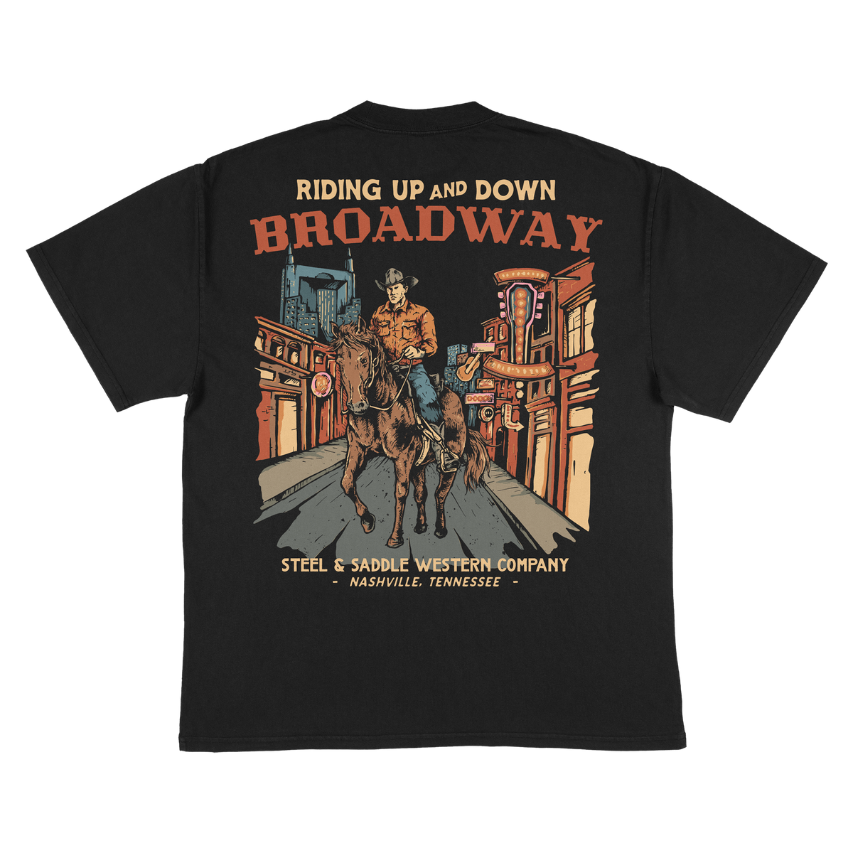 Broadway Tee back print, cowboy riding a horse down neon lit Lower Broadway in Nashville