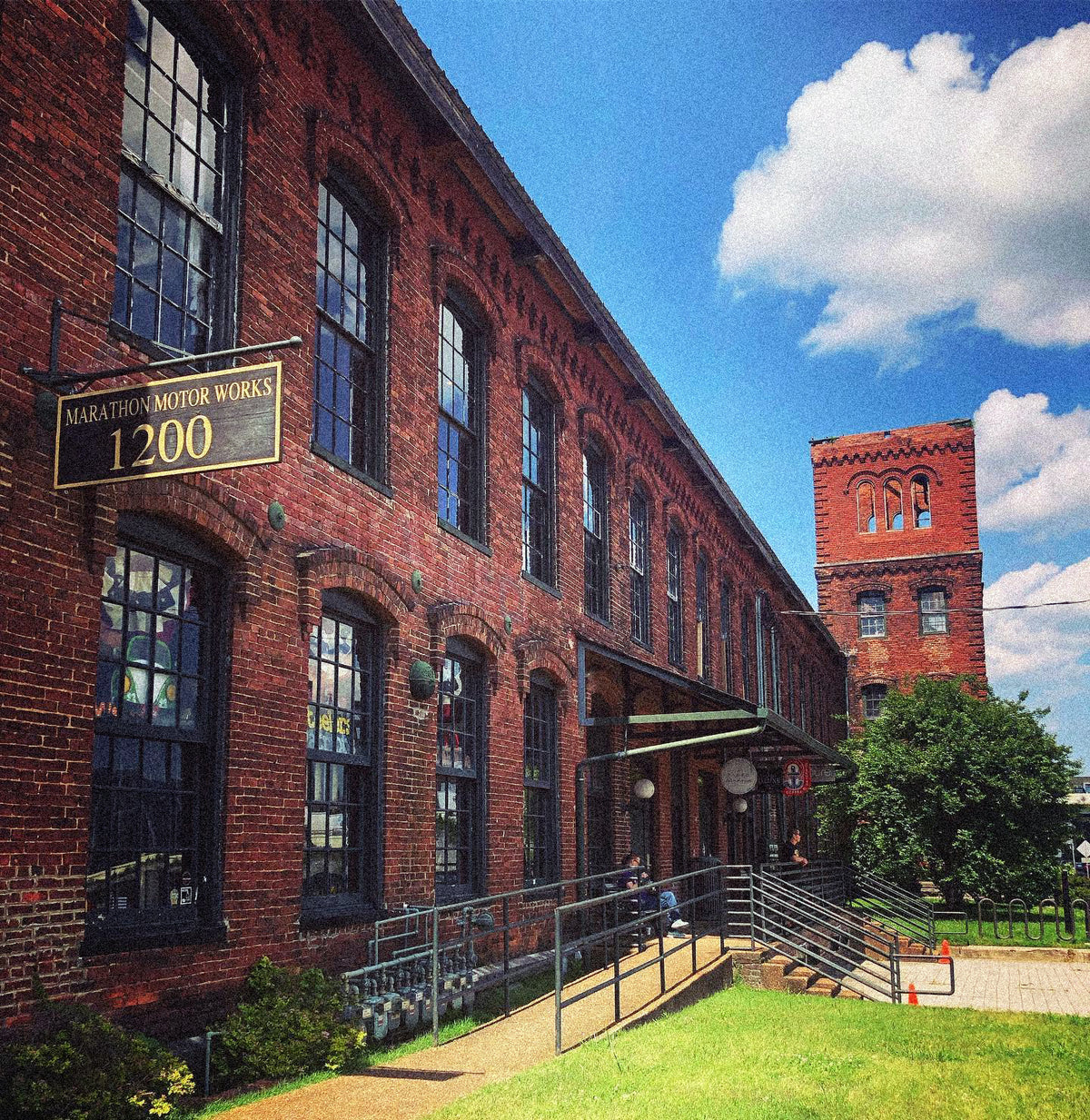 Red brick Marathon Village building with the 1200 sign, home of the Steel & Saddle shop right outside downtown Nashville