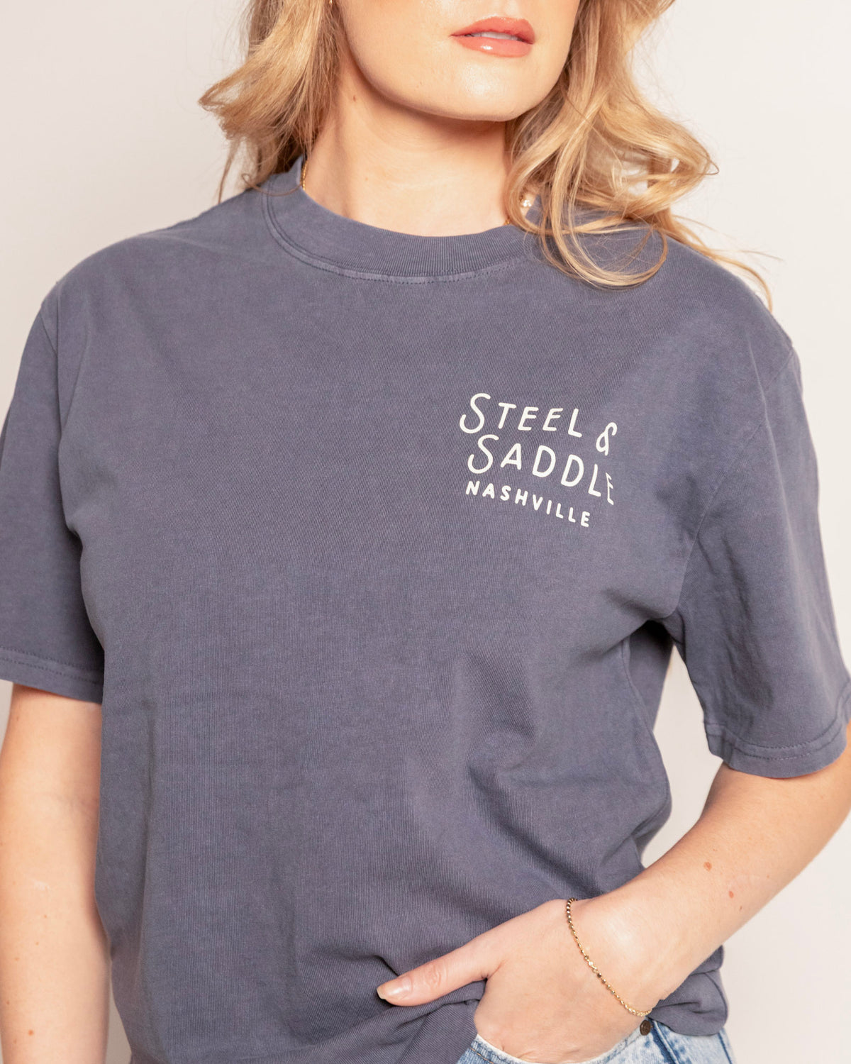 Music City Neon Tee in faded indigo, close-up of the Steel & Saddle Nashville chest print