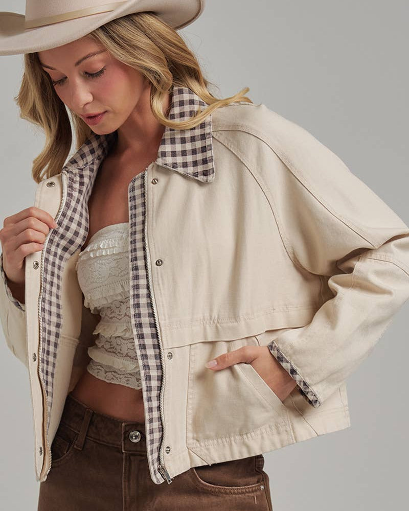 Oxford Canvas Twill Jacket in oatmeal with a brown gingham collar, worn open with a cowboy hat and brown jeans
