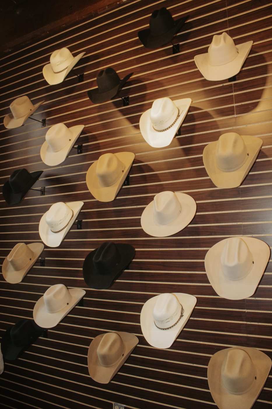 Felt cowboy hats on the hat wall at Steel & Saddle, Marathon Village, Nashville